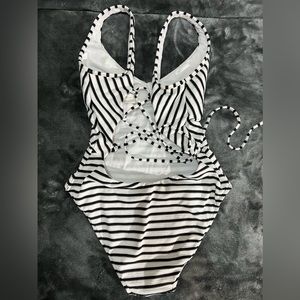 Sexy cross back one piece bathing suit. Worn only once.
